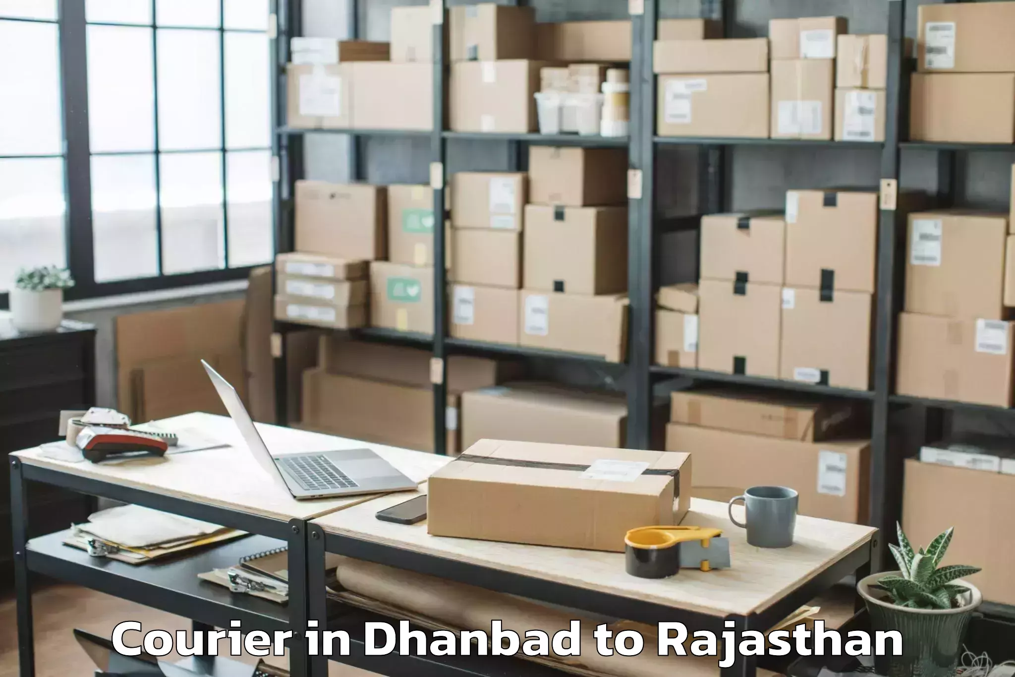 Trusted Dhanbad to Sanchore Courier